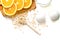 Oat flakes plate with milk, orange, eggs on a wooden white table. Top view of healthy oat flakes breakfast. Copy space