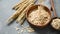 Oat flakes or rolled oats falling in bowl