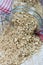 Oat flakes spilling from the glass jar