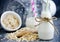 Oat milk in glass jar, homemade oat milk in bottle