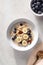 Oat porridge with banana, blueberry, walnut, milk for healthy breakfast