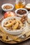 Oatmeal with apples, raisins, cinnamon and ingredients, vertical
