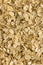 Oatmeal background texture, rolled raw oats, detailed vertical textured macro closeup pattern