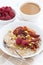 Oatmeal with baked fruit, coffee with milk for breakfast