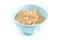 Oatmeal in a Blue Bowl on a White Background