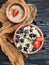 Oatmeal, blueberries, strawberries on wooden background breakfast