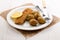 Oatmeal breaded kipper and baby potatoes with herbs