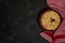 Oatmeal cherry crumble on a dark background. Place for text. View from above.