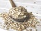 Oatmeal or coarse oats on wooden spoon