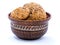 Oatmeal cookies with grains in a deep clay plate_