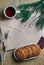 Oatmeal cookies with hot tea on a natural wood kitchen board. Winter composition for an interior with snow-covered