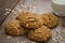 Oatmeal cookies with sesame seeds and glass of milk