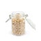 Oatmeal flakes glass jar isolated