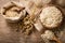 Oatmeal flakes, grains and ears of oat on wooden table