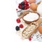 Oatmeal, flour, milk, eggs and berries - ingredients for baking