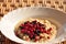 Oatmeal with forest different berries closeup.