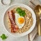 Oatmeal, fried egg, fried bacon. Hearty fat high-calorie breakfast, top view