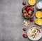 Oatmeal with fruit and freshly squeezed orange juice border ,place for text wooden rustic background top view close up