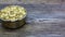 Oatmeal or hercules flake close-up on a plate on wooden background. Healthy diet. Oatmeal porridge