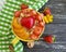Oatmeal porridge, apricot, strawberry, nutrition breakfast heart on a wooden background