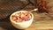 Oatmeal porridge with cherry still life on a black background breakfast, cereal,