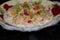 Oatmeal porridge with dried fruits in milk on a plate with snow