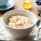 Oatmeal porridge, scottish oats in a bowl