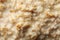 Oatmeal porridge texture on whole background close up