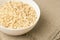 Oatmeal porridge. White bowl. Healthy food. Light background