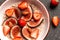 Oatmeal with red figs, strawberries. chia seeds, and walnuts in a bowl, Food for weight loss. View from above