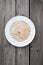 Oatmeal, rolled oats on rustic white wooden background. Food Co