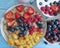 Oatmeal, strawberry, raspberry apricot blueberry sweet homemade freshness yogurt on a blue wooden background