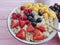oatmeal, strawberry, raspberry apricot healthy blueberry antioxidant yogurt on a pink wooden background