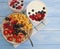 Oatmeal, strawberry, raspberry apricot natural delicious blueberry dessert sweet homemade yogurt on a blue wooden background