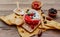 Oats in heart shape bowl with berries