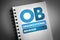 OB - Organizational Behavior acronym on notepad, business concept background