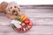 Obedient healthy dogs posing with barf raw meat on wooden surface