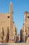 The obelisk and the statues of Ramesses II