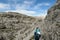 Oberbachernspitze - A woman hiking in a high and desolated mountains in Italian Dolomites.