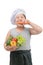 Obese boy chef eating carrot isolated