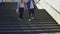 Obese couple walking on stairs, happy together, acceptance of person as he is