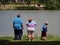 Obese family stand by Lake