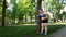 Obese girl tired after jogging, leaning on tree, tiresome workouts outdoors