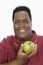 An Obese Man Holding Green Apple