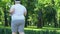 Obese man jogging to lose extra weight, active lifestyle and motivation, sport