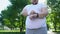 Obese man monitoring heart beat on smartwatch after jogging, app for healthcare