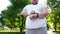 Obese man monitoring heart rate on smartwatch after jogging, app for healthcare