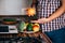 Obese man recording video cooking healthy food