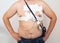 An obese man undergoes a Holter monitoring of the heart. A modern method for studying the heart in caodiology. Arrhythmia and