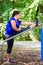 Obese woman doing sport stretching outdoors in park